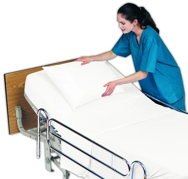 Hospital bed with white linen