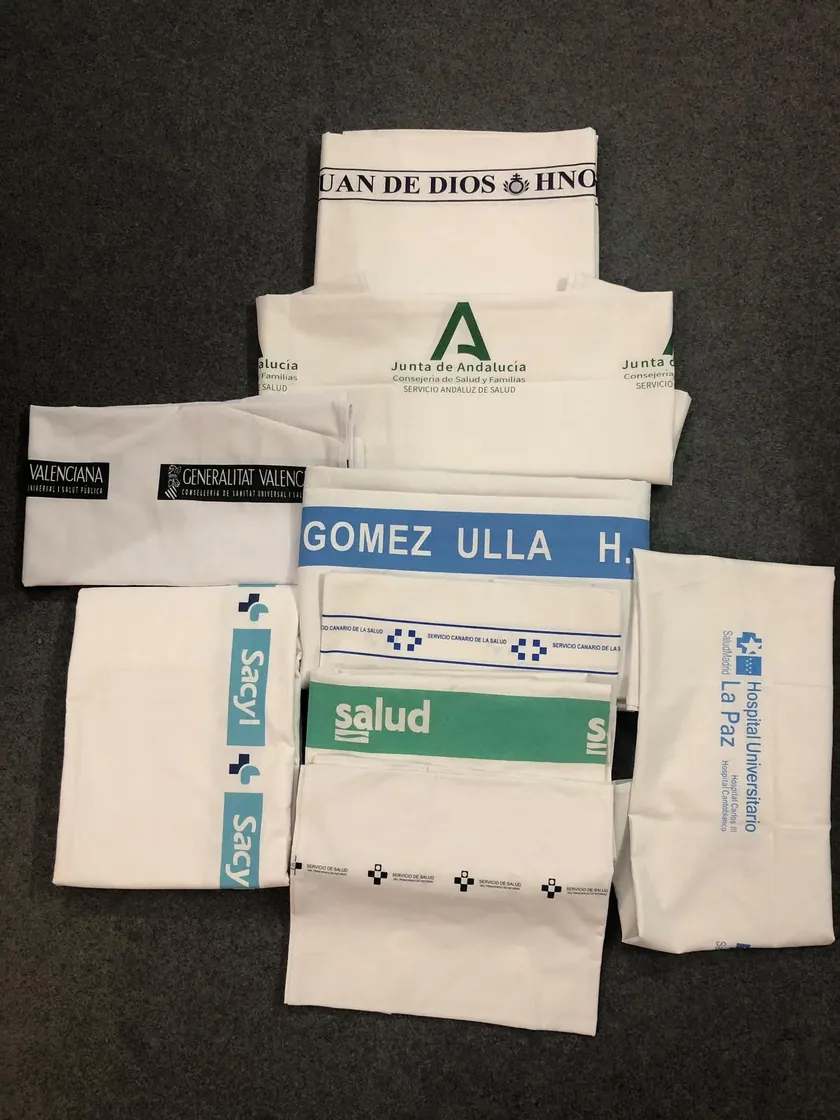 Green and white surgical fabric swatches and branded products